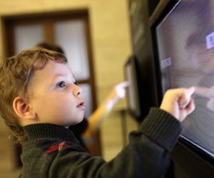 A child tries out an exhibit at The Children's Museum, Edinburgh