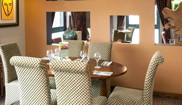 Table set for dinner inside Thyme Restaurant located inside Premier Inn Camberley hotel