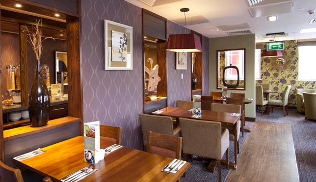 Tables laid for breakfast at Premier Inn Coventry hotel.