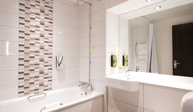 Standard bathroom with shower over bath at Tottenham Hale hotel