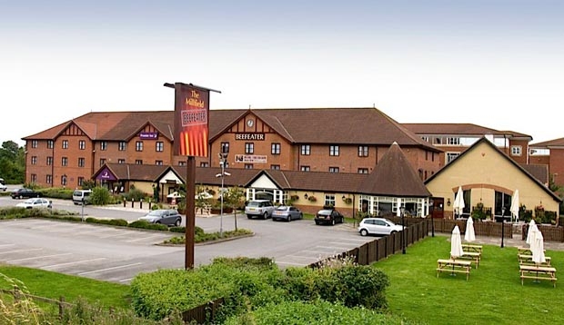 Exterior of Premier Inn York North West showing car park area
