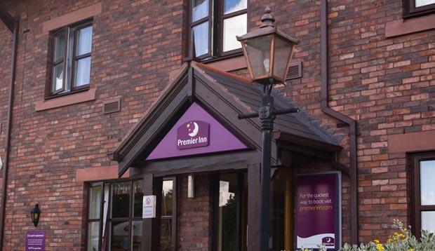 Front door of Premier Inn Carlisle Central hotel with covered entrance