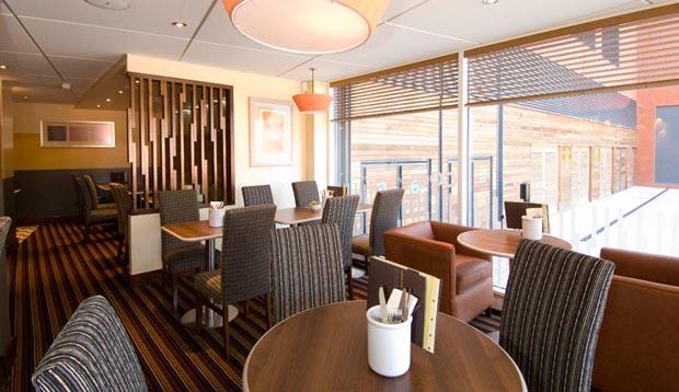 Tables next to the window at Premier Inn Coventry City Centre (Belgrade Plaza) restaurant