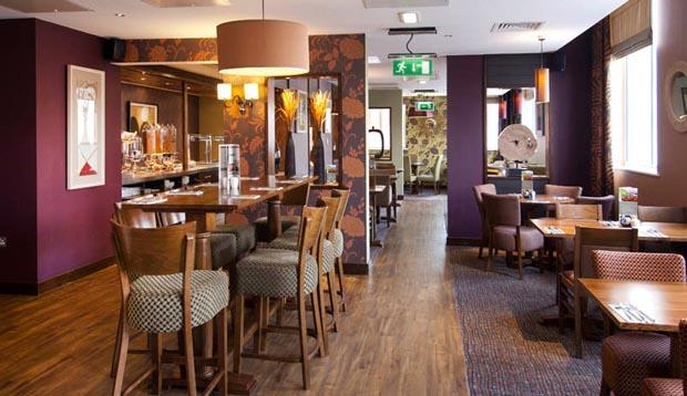 Tables laid for breakfast at Premier Inn Coventry hotel. 