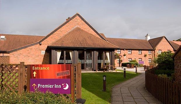 Entrance to Premier Inn Crewe West hotel with restaurant sign