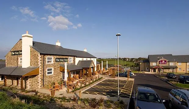 Exterior of Premier Inn Helston showing car park