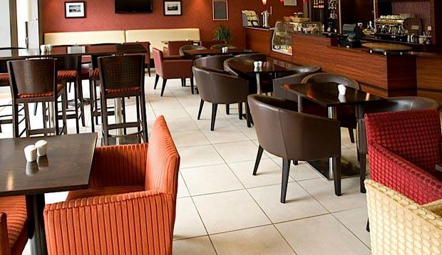 Restaurant at Premier Inn London City (Tower Hill) showing tables and chairs