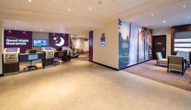 Reception area at Premier Inn Manchester City Centre (Arena/Printworks) hotel showing self check in 