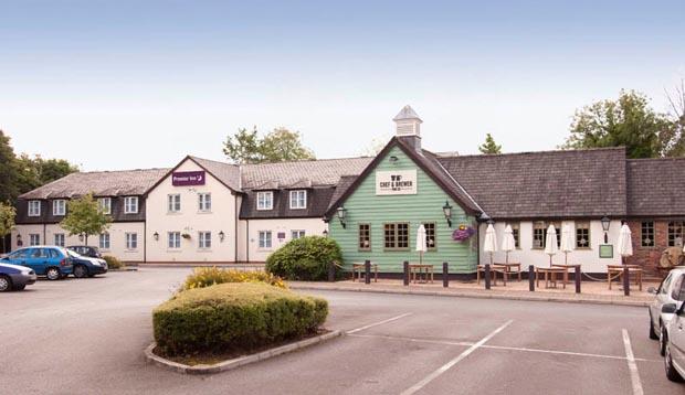 Exterior at Premier Inn Manchester (Handforth) hotel showing car park
