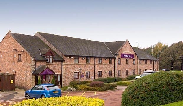 Exterior of Premier Inn Rochdale showing surrounding countryside and car park