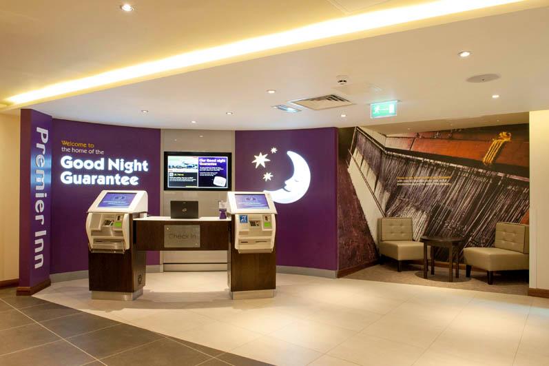 Reception area at Premier Inn Trowbridge showing self check in kiosks