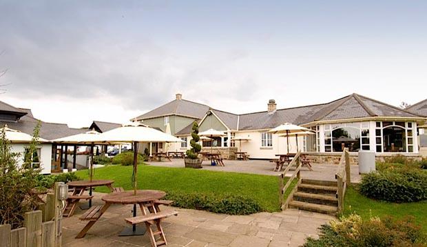 Exterior of Premier Inn Truro showing outdoors restaurant area