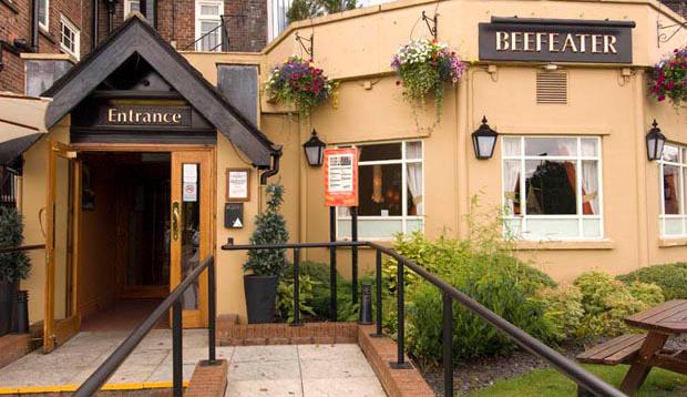 Exterior of entrance to Premier Inn Manchester (Heaton Park) hotel