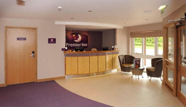 Reception at Premier Inn Redditch North (A441) showing seating area