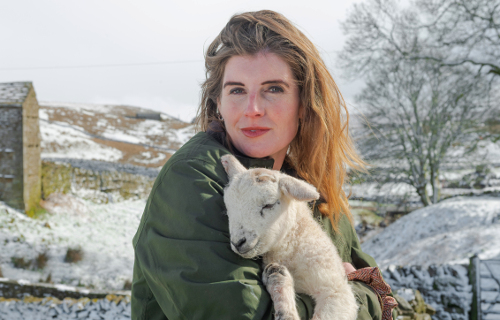Amanda Owen and one of her lambs