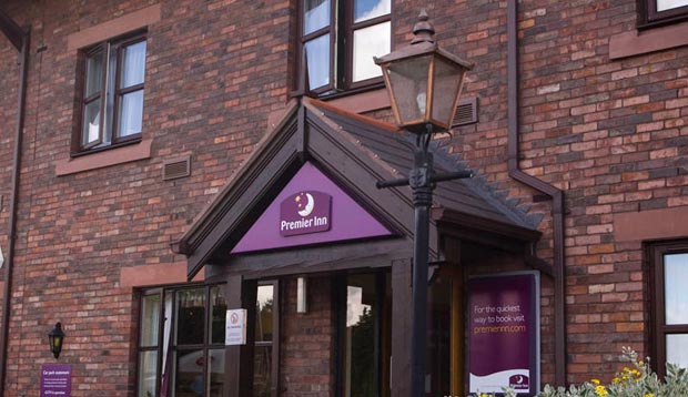 Front door of Premier Inn Carlisle Central hotel with covered entrance