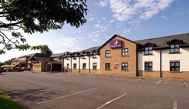 Exterior of Premier Inn Cardiff West showing car park