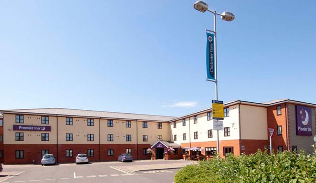 Exterior of Premier Inn Hotel Chichester showing car park