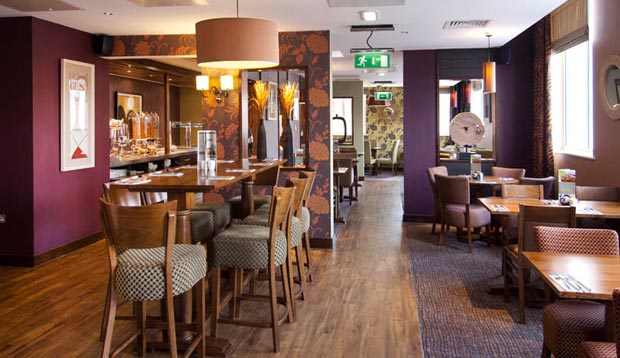 Tables laid for breakfast at Premier Inn Coventry hotel. 