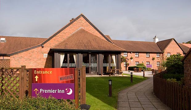 Entrance to Premier Inn Crewe West hotel with restaurant sign
