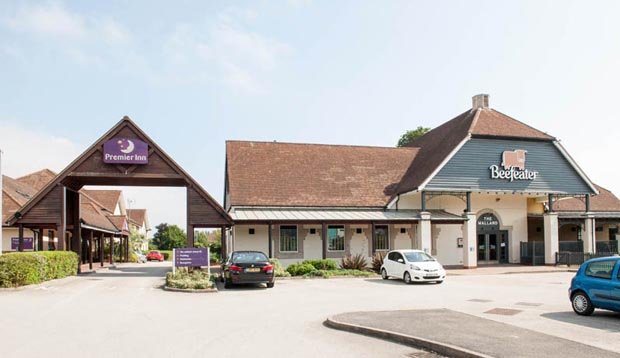 Exterior of Premier Inn Derby West with Beefeater sign