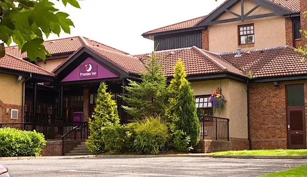 Exterior of Premier Inn Glasgow East showing surrounding greenery