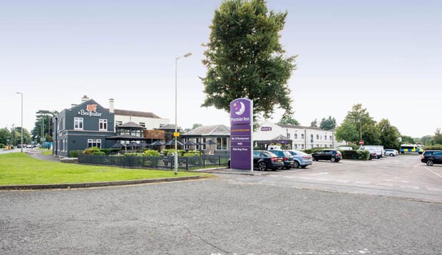 Exterior of Premier Inn Gloucester (Longford) showing car park
