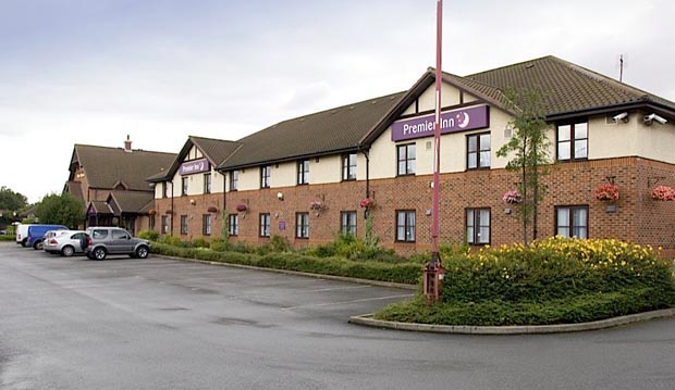 Exterior of Premier Inn Grimsby showing car park
