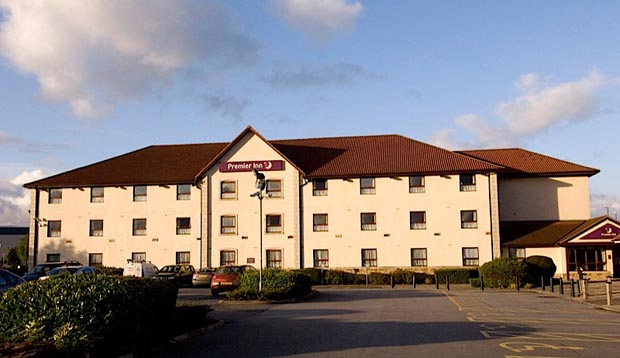 Exterior of Premier Inn Haydock showing car park 