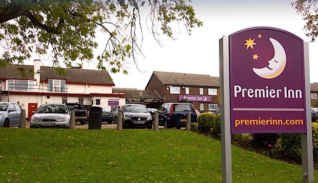 Exterior of Premier Inn Knutsford (Bucklow Hill) showing car park and Premier Inn sign 