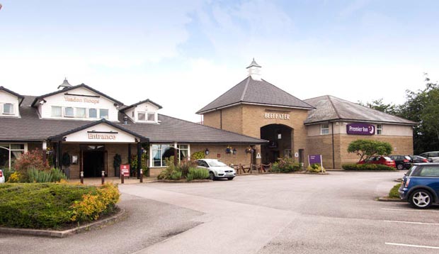 Car park and exterior of Premier Inn Leeds / Bradford Airport hotel