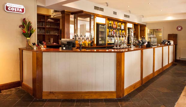 Bar area at Premier Inn Leicester (Braunstone) hotel showing Costa coffee area