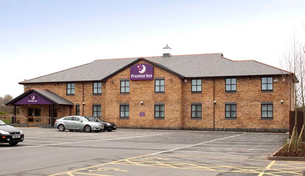 Exterior at Premier Inn Llanelli Central West hotel showing car park