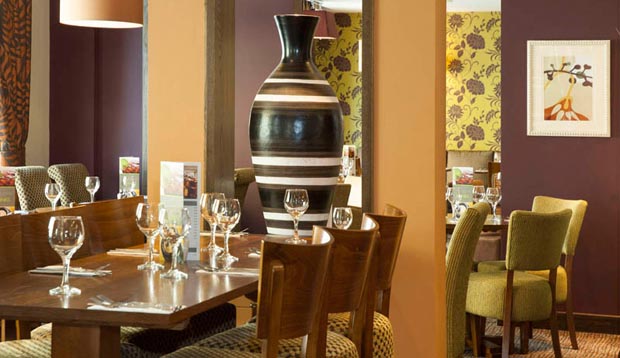 Restaurant area with tables set at Premier Inn London Southwark (Tate Modern) hotel