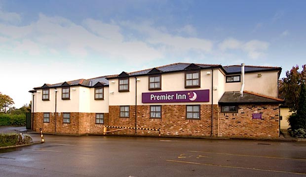 Exterior of Premier Inn Macclesfield South hotel showing car park