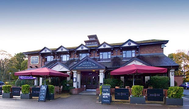 Exterior at Premier Inn Manchester (Wilmslow) hotel showing outdoor seating area