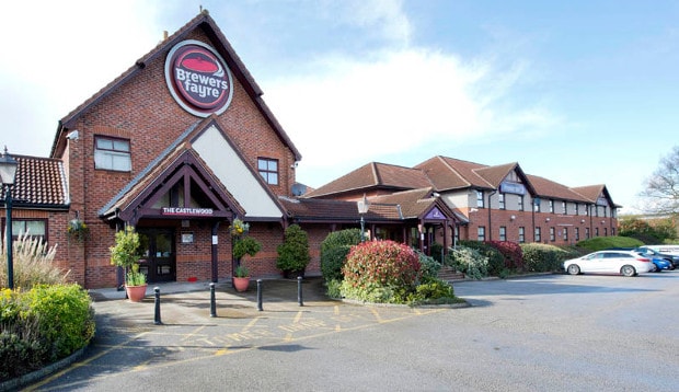 Exterior of restaurant at Premier Inn Mansfield hotel showing car park