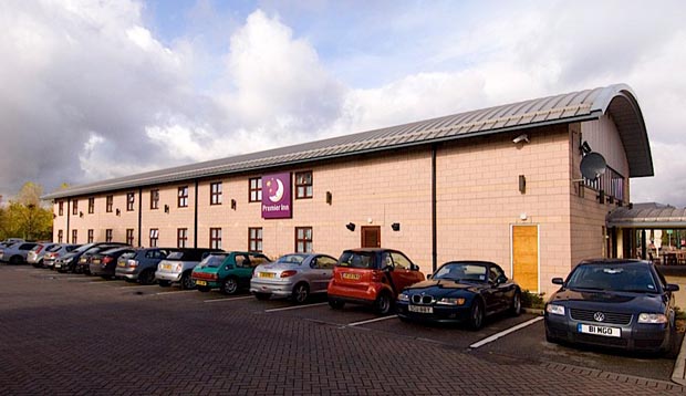 Exterior of Premier Inn Manchester (Cheadle) hotel showing car park and exterior