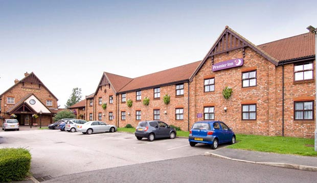 Car park and exterior at Premier Inn Manchester (Denton) hotel