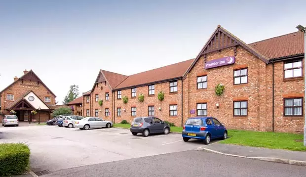 Car park and exterior at Premier Inn Manchester (Denton) hotel