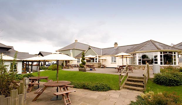 Exterior of Premier Inn Truro showing outdoors restaurant area